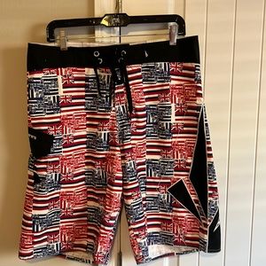 Volcom Hawaiian flag print board shorts.